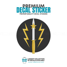 Decal sticker with a sword and lightning bolt design on a black background, featuring text about premium quality and a website URL.