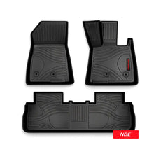 Three-piece black rubber car floor mat set with textured tread patterns, shown on a white background with an NDE logo badge in the bottom right corner.