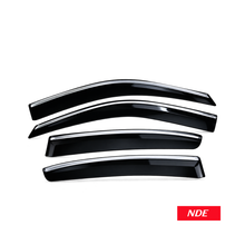 Four glossy black car window sun visor shields arranged diagonally on a white background, with an NDE logo badge in the bottom right corner.