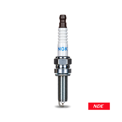 An NGK spark plug with a white ceramic body, blue NGK logo, and silver metal electrode, shown vertically on a white background with a red 'NDE' label in the bottom right corner.