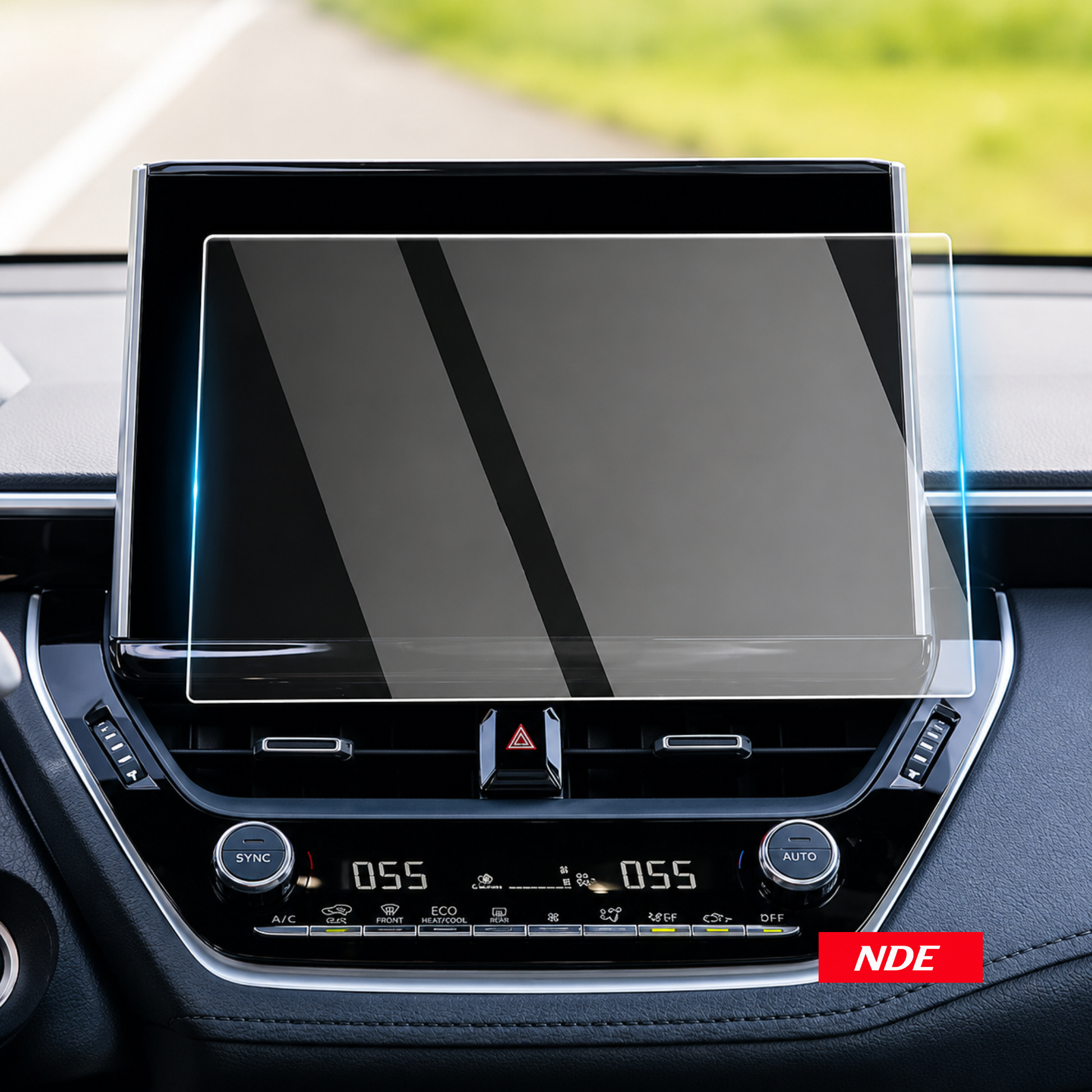 A clear screen protector with blue and green alignment labels is being applied to a car infotainment touchscreen by two hands inside a vehicle. Text at the top reads 'Easy To Stick & No Bubble' and a red badge at the bottom right says 'NDE'.