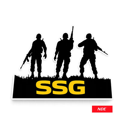 A die-cut sticker featuring black silhouettes of three soldiers standing on a grassy outline with the bold yellow letters 'SSG' across a black base. A small red 'NDE' label appears in the bottom right corner on a white background.